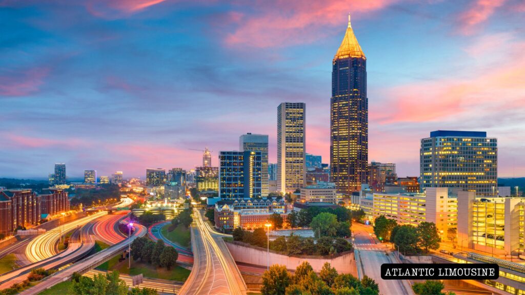 Atlanta skyline at dusk with illuminated skyscrapers and a glowing sky transitioning from warm sunset tones to deep blue, capturing the city’s modern architecture and vibrant urban energy.